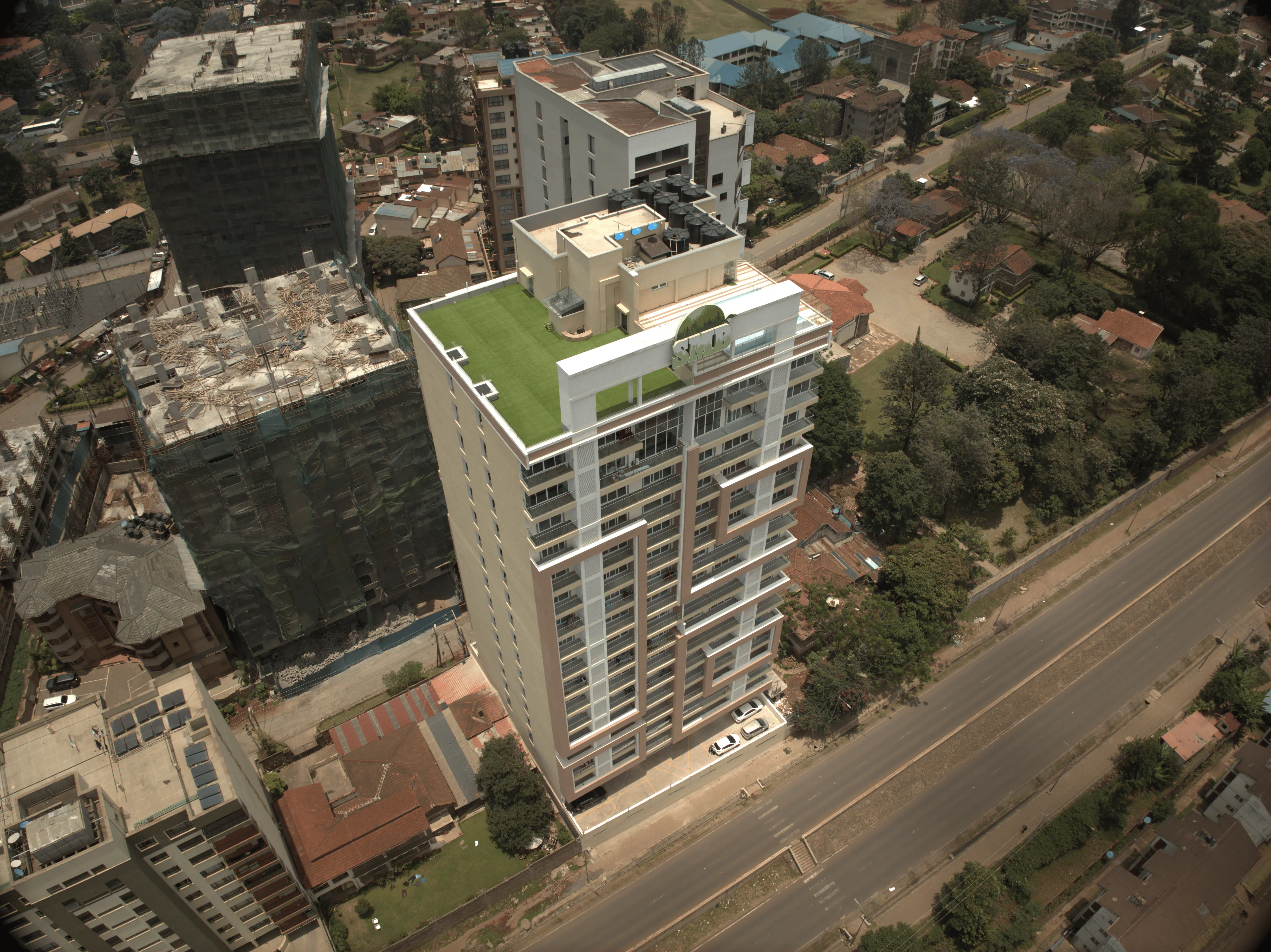 Rooftop lawn & community seating - Karura View by SMB Properties, Parklands Nairobi; ideal for yoga with Karura Forest views
